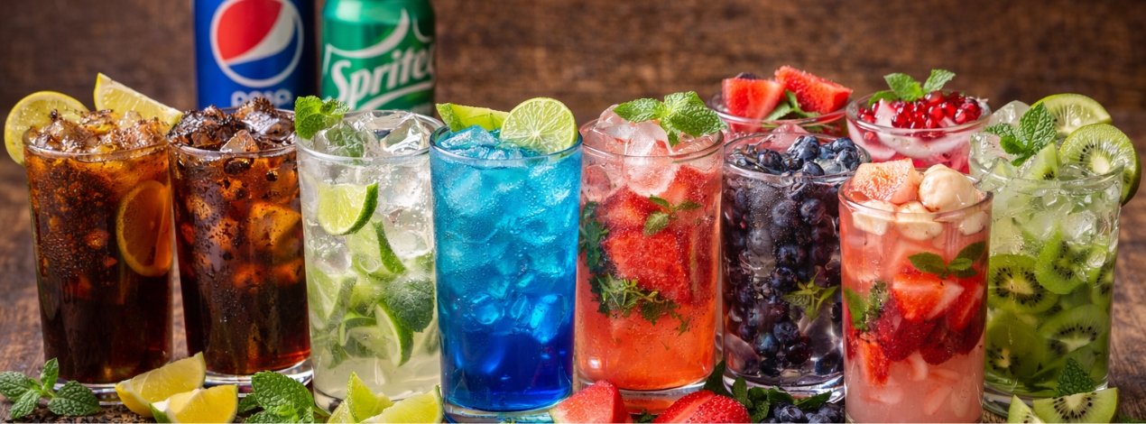 Refreshing cold beverages served at The Nomad Nosh café in Hennur, Bangalore, including mojitos, coolers, and chilled drinks.